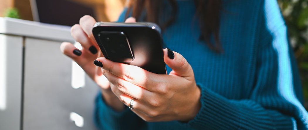 close-up of hands holding a smartphone