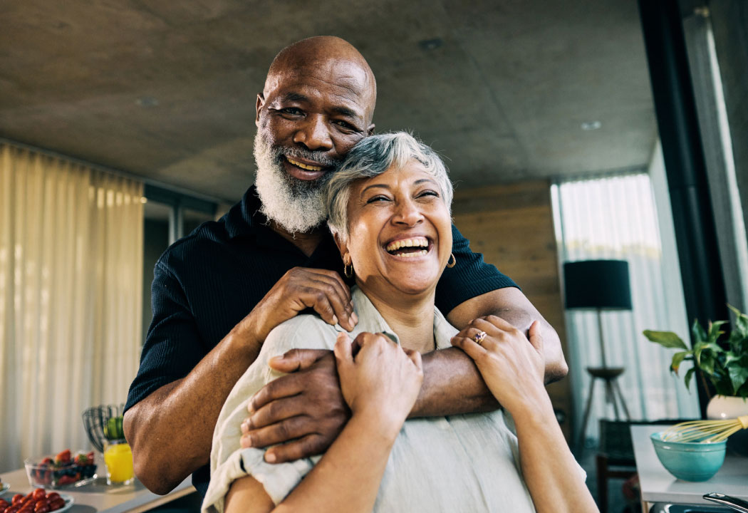 mature couple embracing in a modern house