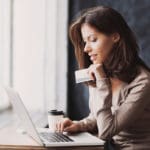 Woman Checking Card Balance Online