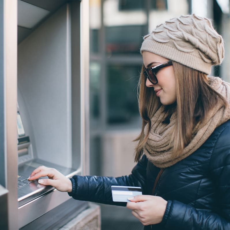 Woman at ATM Photo